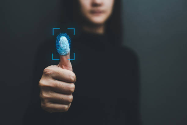 A person demonstrating fingerprint scanning technology, highlighting biometric security in electronics.