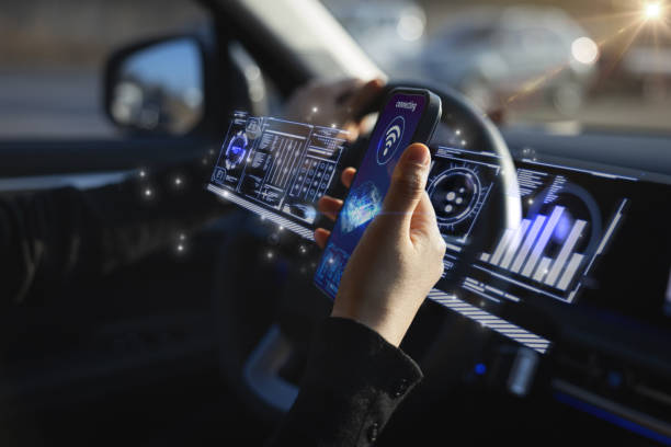 A person using futuristic digital interfaces inside an autonomous vehicle, highlighting advancements in technology.